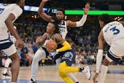 During Tuesday’s Game 2 in Memphis, Timberwolves players surrounded Grizzlies guard Ja Morant — it’s a team effort to contain him — but he sti