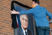 Vice President Walter Mondale’s portrait at the University of Minnesota Law School was draped with a black sash after his death at age 93 in April 2