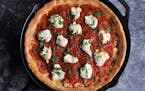 The skillet pizza is similar to a Chicago deep-dish pizza, but lighter and airier.