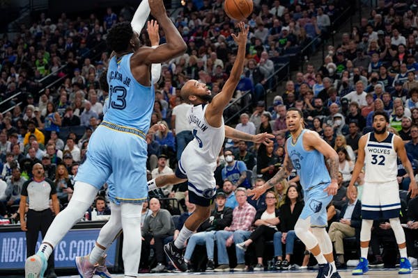 Wolves guard Jordan McLaughlin, center, went up for a shot in the second half Saturday night at Target Center, when he scored 16 points on 5-for-6 sho