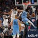 Wolves center Karl-Anthony Towns attempted to stop fellow All-Star Ja Morant as the Grizzlies guard drove to the basket late in Saturday’s playoff g