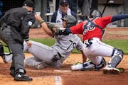 New Twins catcher Jose Godoy tagged out AL MVP Jose Abreu to end the top of the third inning.