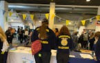 FFA students check-in with staff inside the Lee & Rose Warner Coliseum at the Minnesota State Fairgrounds on Monday during the Career Connections job 
