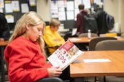 Anna DeMarre, a senior at Burnsville High School, read an admissions guide during a recent presentation for prospective students at the University of 