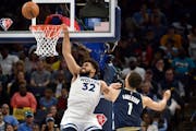 Timberwolves center Karl-Anthony Towns is fouled as he shoots against Grizzlies forward Kyle Andersonin the first half 