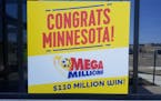 A sign outside Minnesota Lottery headquarters celebrates the state’s first Mega Millions jackpot winner.