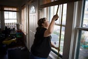 In 2017, Tasha Julius, production manager for the nonprofit Sustainable Resource Center, measured windows that will be replaced at Bravlia Rendon’s 