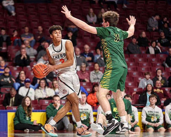 Cherry’s Isaac Asuma (3) looks to make an outlet pass around Nevis defender in Class 1A quarterfinals.