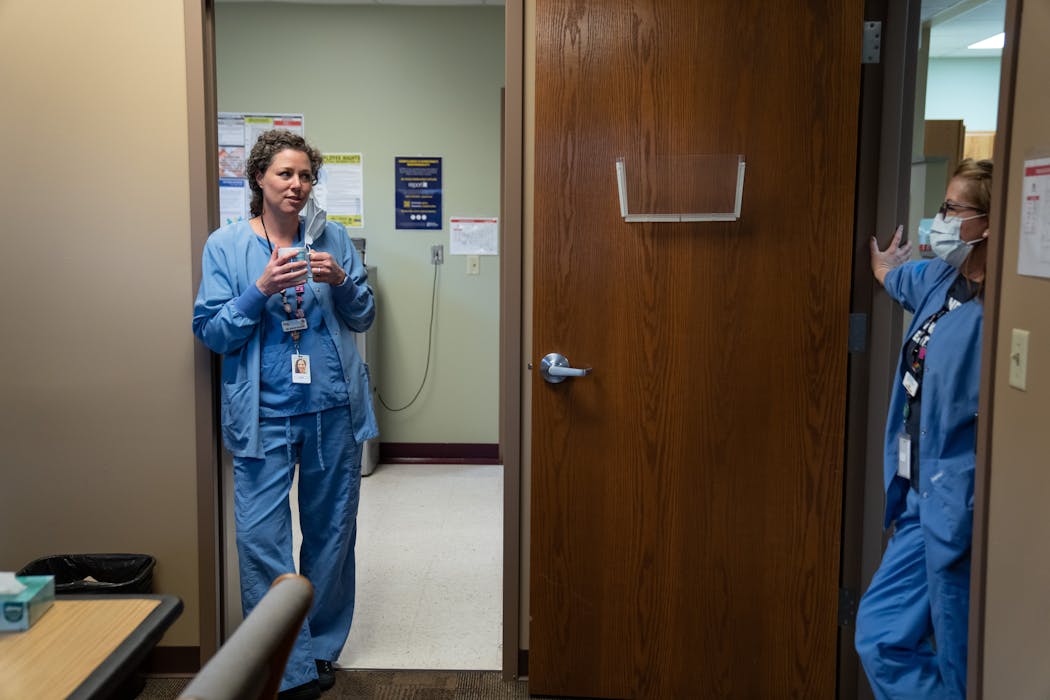 Dr. Sarah Traxler chats with a registered nurse on a break during her monthly rotation at the only Planned Parenthood in South Dakota.