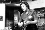 Julia Child prepares a dish for a TV audience in 1970. 