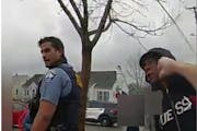 A screenshot from body camera footage shows Minneapolis police officer William Gregory punching Damareion McKizzie in the face before he is taken into
