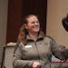 Tiana Lueck with the National Eagle Center smiled as Latsch, a six-year-old partly blind bald eagle, let out a call during a presentation Friday at th