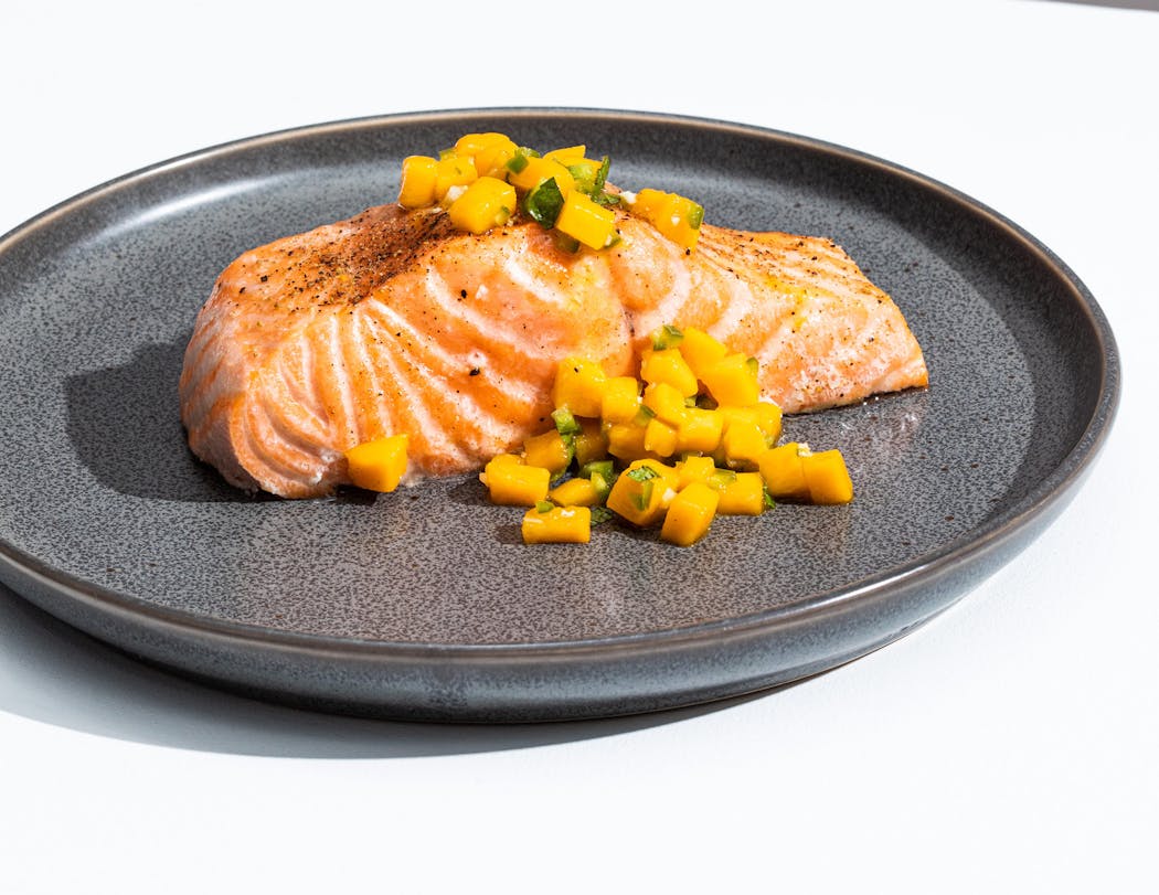 Oven-Roasted Salmon with Mango-Mint Salsa is easy and delicious. From “The Complete Cookbook for Teen Chefs.”