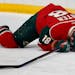 Ryan Carter, shown here sprawled on the ice in 2015 with the Wild, said playing through pain is just part of the NHL playoffs.