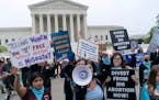 Demonstrators outside of the U.S. Supreme Court on Tuesday. A leaked draft opinion suggests the court could be poised to overturn the landmark 1973 Ro