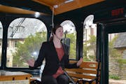 Jenifer Majerus, a tour guide with the Rochester Trolley & Tour Company, describes features of the Plummer House, a famous home in Rochester, Minn., d