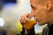 Bryan Moore of Three Floyds Brewing in Munster, Ind., tipped back a sample of Hopsteiner Solero double IPA at the national Craft Brewers Conference at