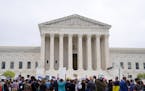 Demonstrators protested outside the Supreme Court in May after a draft opinion was leaked that overturns Roe v. Wade.