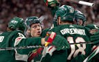 Joel Eriksson Ek (14) of the Minnesota Wild celebrates with teammates after scoring in the first period Tuesday, May 4, at Xcel Energy Center in St. P