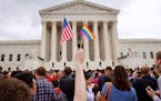 A crowd celebrates outside of the Supreme Court in Washington on June 26, 2015, after the court declared that same-sex couples have a right to marry a