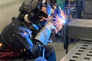 An employee works at ProFab Welding & Machine in Lakeville, which Troy Heuermann purchased using retirement savings in a Rollovers for Business Startu