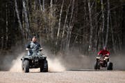 Two ATV riders drove near the Nemadji State Forest in 2021. Much larger off-road vehicles would be permitted on state trails under a proposal to raise