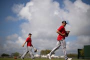 Twins player Royce Lewis (4) headed to another field for drills during spring training.