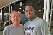 Patrick Reusse with Miguel Sano in 2015.