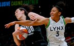 Seattle forward Breanna Stewart pulls a rebound away from Lynx guard Aerial Powers during the second quarter Friday.