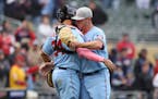 Minnesota Twins relief pitcher Emilio Pagan, right, celebrated with catcher Gary Sanchez (24) after defeating the Oakland Athletics.