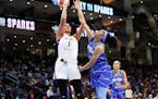Sparks center Liz Cambage (left, shown shooting against Chicago in a game Friday) scored 22 points and grabbed 11 rebounds in Los Angeles’ 87-77 vic