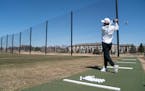 Jared Larson of Woodbury hit balls at the driving range at Ponds at Battle Creek golf course in Maplewood in April last year.