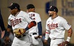 (From left) Second baseman Jorge Polanco, designated hitter Byron Buxton and shortstop Royce Lewis celebrated the Twins’ 2-1 win over Oakland at Tar