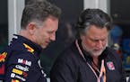 Red Bull Racing team principal Christian Horner, left, talks with Michael Andretti after the qualifying sessions for the Formula One Miami Grand Prix,