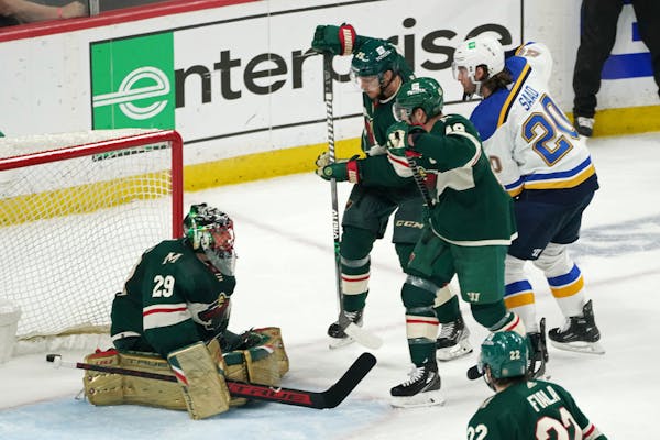 St. Louis Blues' Brandon Saad (20) scores a goal off Minnesota Wild goalie Marc-Andre Fleury (29) to tie the game in the second period of Game 5 of an