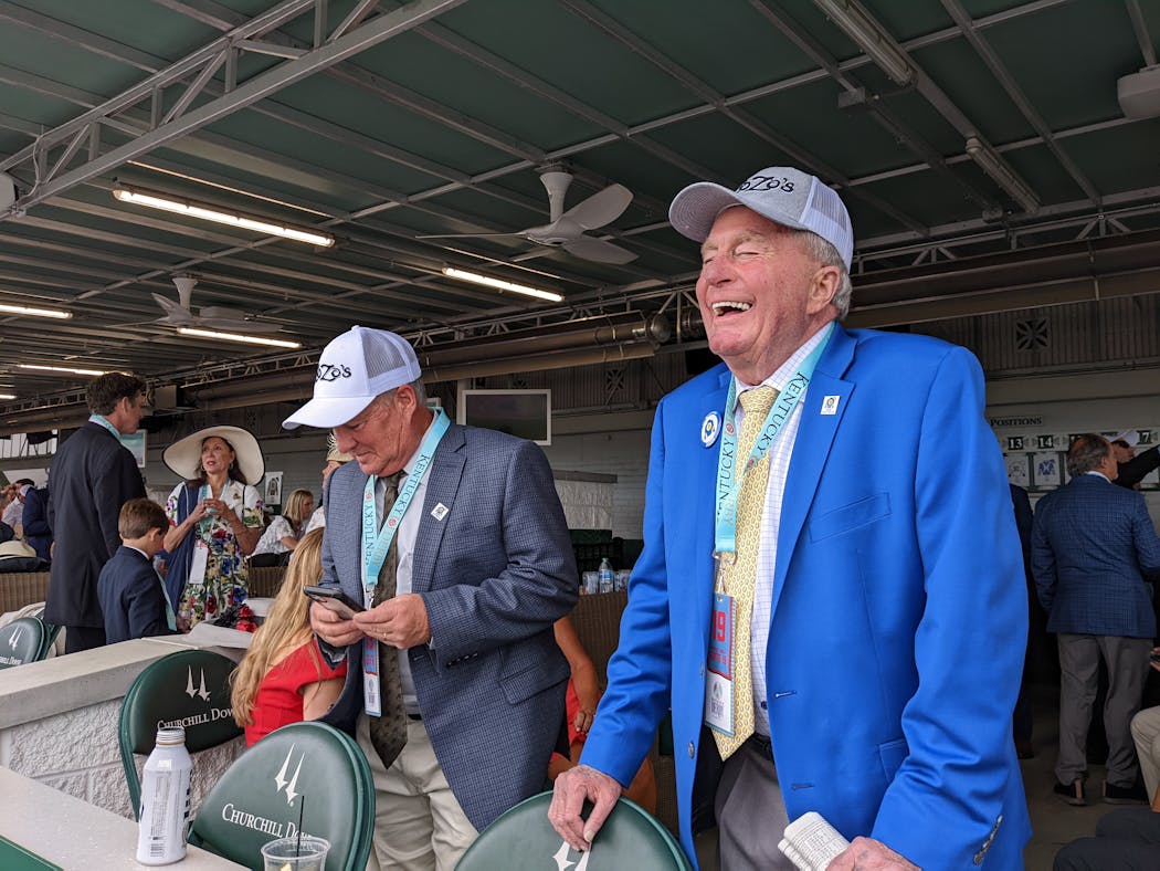 Barry Butzow, right, got to watch his horse from an owner's suite on Derby Day, and invite the people who helped get them there.