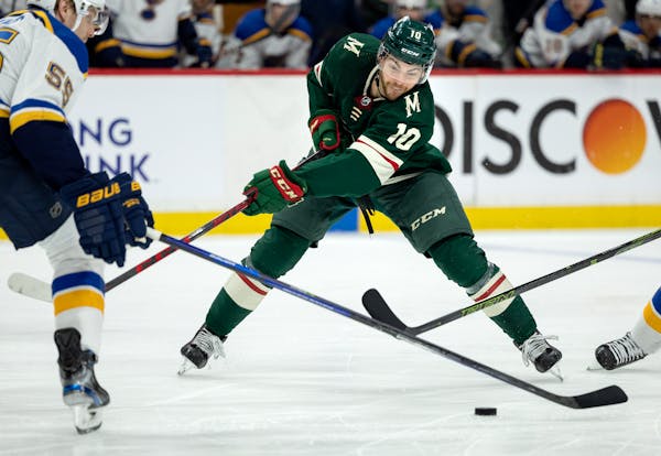Wild center Tyson Jost looked to stickhandle against the St. Louis defense in Game 3 on Tuesday at Xcel Energy Center.