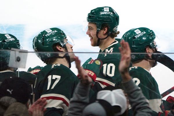 Minnesota Wild's Tyson Jost (10) skates past the bench after his goal against the Colorado Avalanche during the first period of an NHL hockey game, Fr