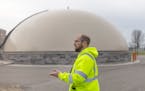 Wastewater services manager Jacob Ethen stands in front of a dome where St. Cloud’s treatment plant stores methane gas that will be burned to produc