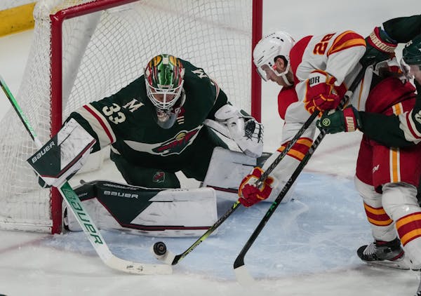 Wild goaltender Cam Talbot stopped a shot by Calgary’s Elias Lindholm on April 28 at Xcel Energy Center.