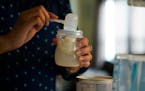 Olivia Godden prepares a bottle of baby formula for her infant son, Jaiden, Friday, May 13, 2022, at her home in San Antonio. Godden has reached out t