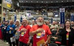 Delegates recite the Pledge of Allegiance at the start of the Minnesota State Republican Convention in Rochester. 