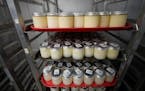 Trays of breast milk sit in containers in a cooler at the Mothers’ Milk Bank for distribution to babies Friday, May 13, 2022, at the foundation’s 