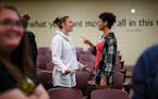Ninth-graders Macy Sirek, left, and Haylie Starr run through a list of things to say to discourage people actively using hateful language during an �