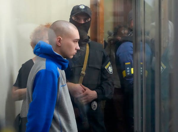 Russian army Sergeant Vadim Shishimarin, 21, is seen behind a glass during a court hearing in Kyiv, Ukraine, Friday, May 13, 2022. The trial of a Russ