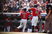 Luis Arraez (2) was welcomed back to the dugout by Gary Sanchez after Arraez scored on a single by Max Kepler in the first inning of the Twins’ 3-1 