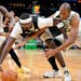 Bucks center Bobby Portis, center, vied for the ball with Celtics guard Marcus Smart, left, and center Al Horford during the first half of Game 7 of a