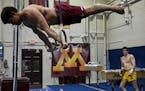 The Gophers’ Yaroslav Owens-Pochinka (shown practicing at Cooke Hall in April) won the GymACT national title on still rings with a score of 13.800 o
