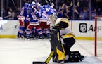 Penguins goaltender Tristan Jarry slowly got up as the Rangers celebrated a game-winning goal by Artemi Panarin in overtime in Game 7 of the Stanley C