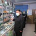 In this photo provided by the North Korean government, North Korean leader Kim Jong Un, center, visits a pharmacy in Pyongyang, North Korea on Sunday,